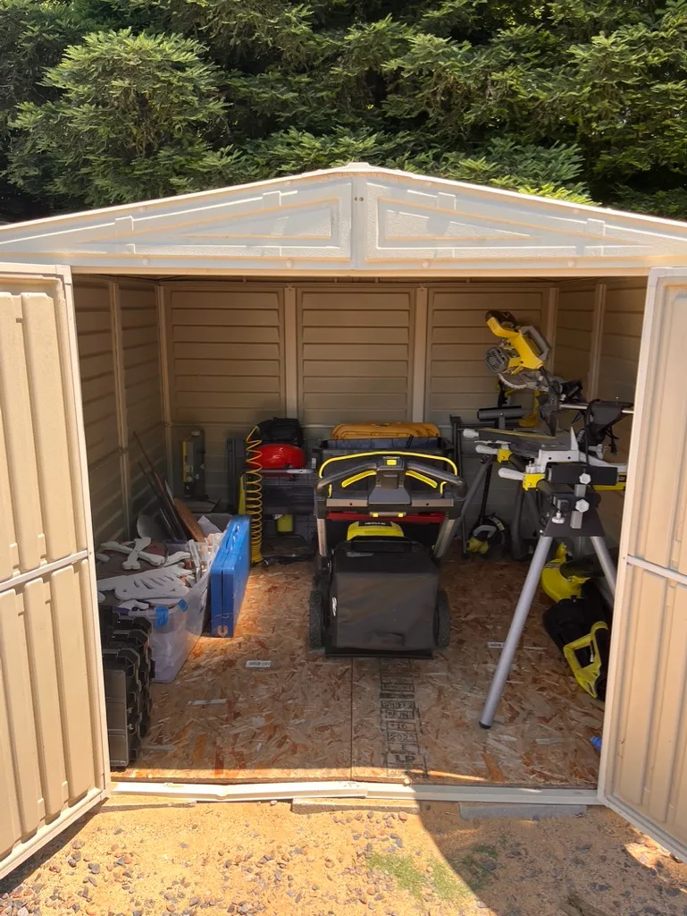 A garage organized with household and yard tools